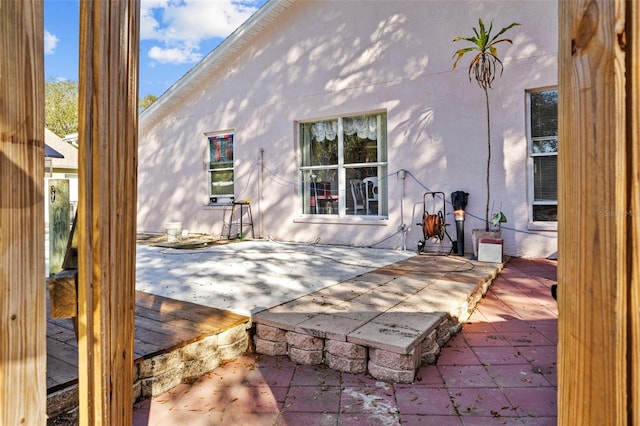 rear view of property with a patio area and a deck