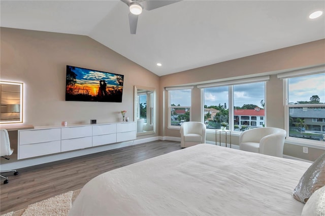 bedroom with ceiling fan, dark hardwood / wood-style flooring, and lofted ceiling