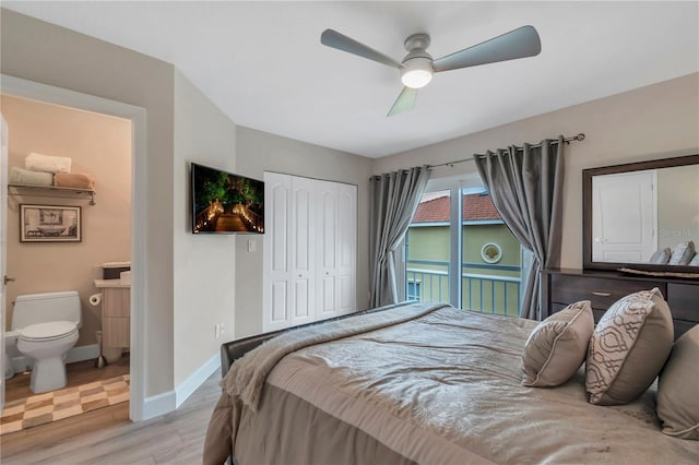 bedroom featuring ceiling fan, a closet, ensuite bathroom, and light wood-type flooring