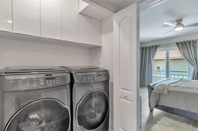 laundry area featuring washer and dryer, ceiling fan, cabinets, and light hardwood / wood-style flooring