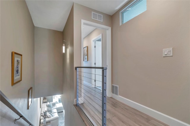 hallway featuring light hardwood / wood-style flooring