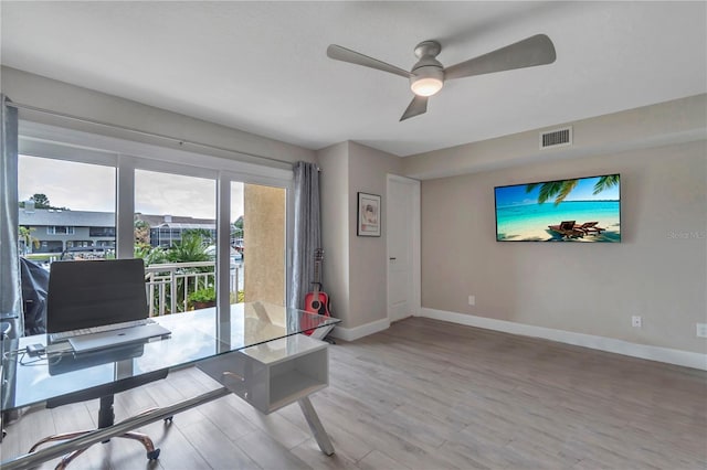 office area with hardwood / wood-style flooring and ceiling fan