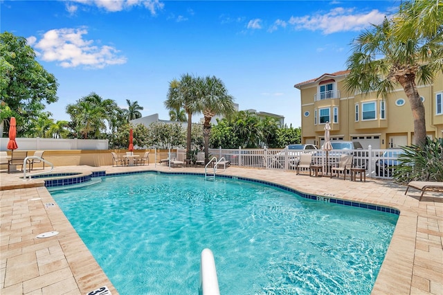 view of swimming pool with a patio area