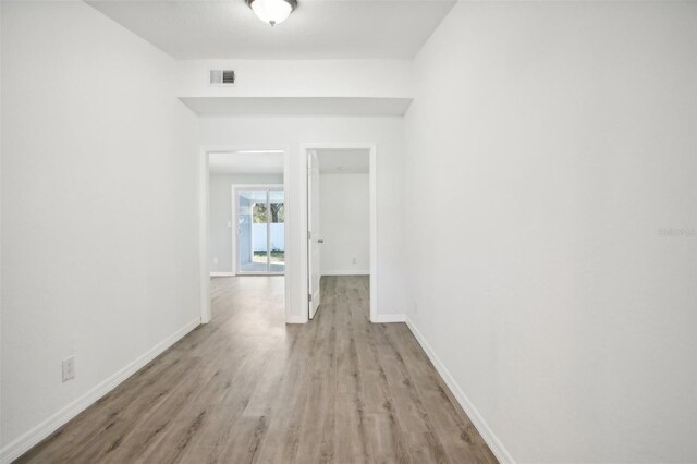 2537 Martha Ln, Land O Lakes, FL 34639 - spare room with wood finished floors and baseboards