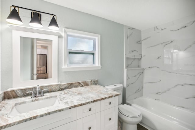 full bathroom with vanity, toilet, and tiled shower / bath combo