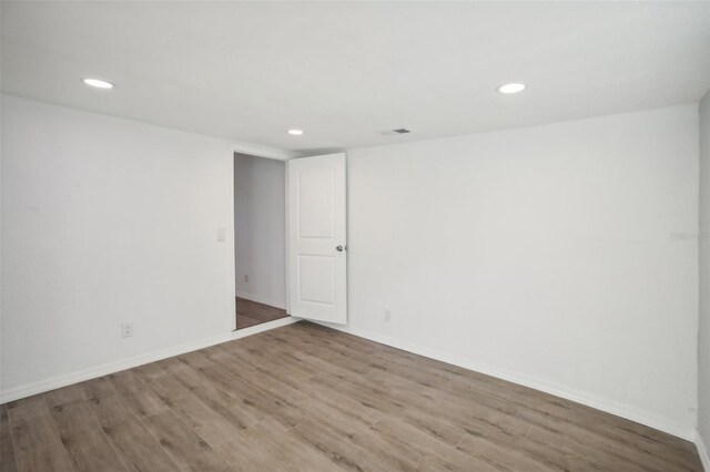 2537 Martha Ln, Land O Lakes, FL 34639 - spare room featuring wood finished floors, recessed lighting, and baseboards