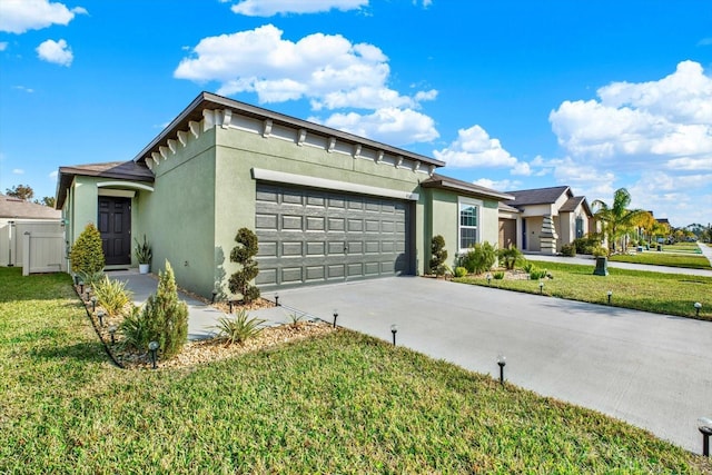 view of front facade featuring driveway, a front lawn, an attached garage, and stucco siding