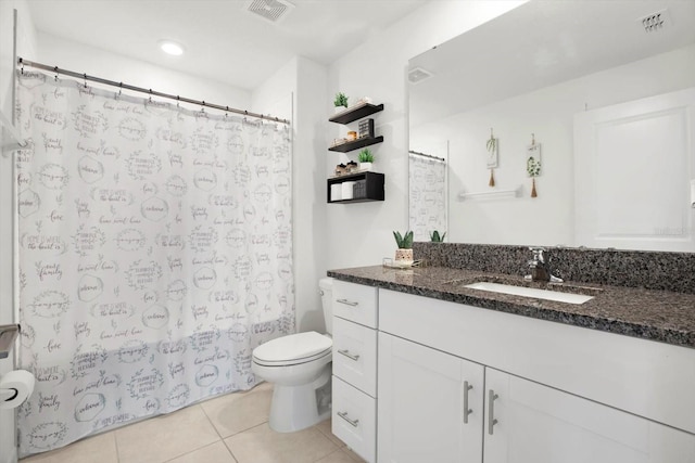 full bathroom with visible vents, toilet, tile patterned floors, curtained shower, and vanity