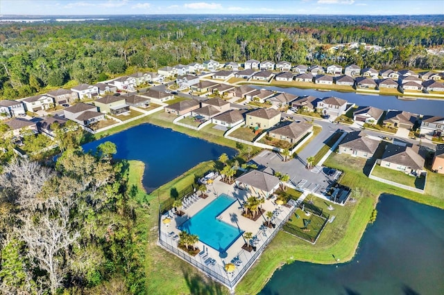 drone / aerial view featuring a water view and a residential view