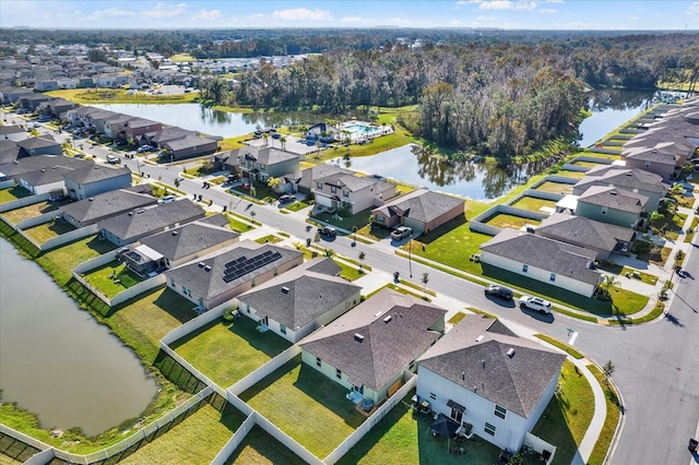 birds eye view of property with a water view and a residential view