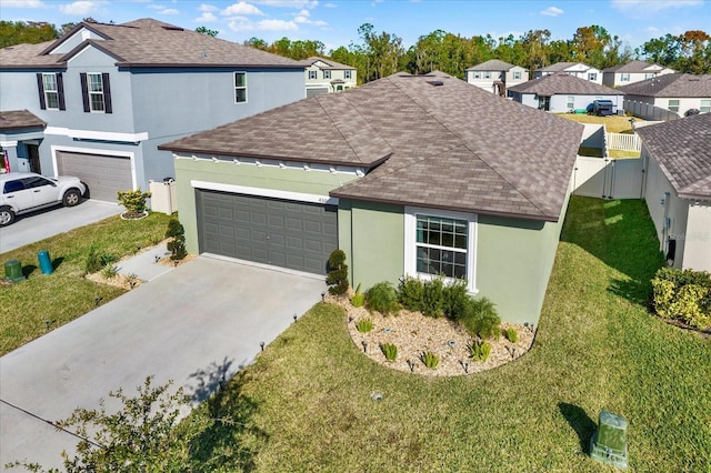 view of front facade with driveway, a residential view, a gate, and stucco siding