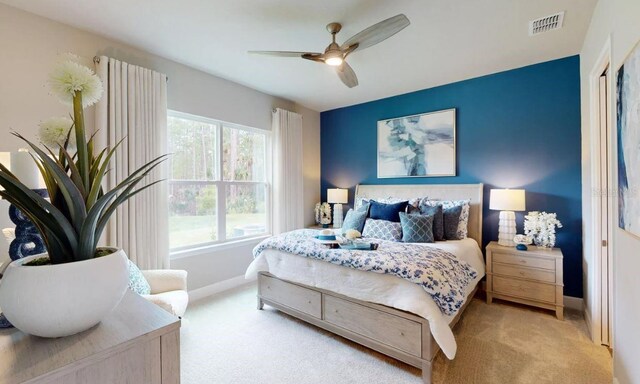 carpeted bedroom featuring ceiling fan