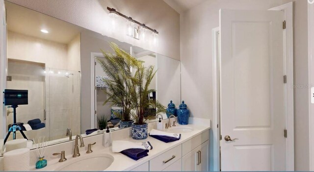 11 Regency Rd, Ormond Beach, FL 32174 - bathroom featuring double vanity and a shower stall