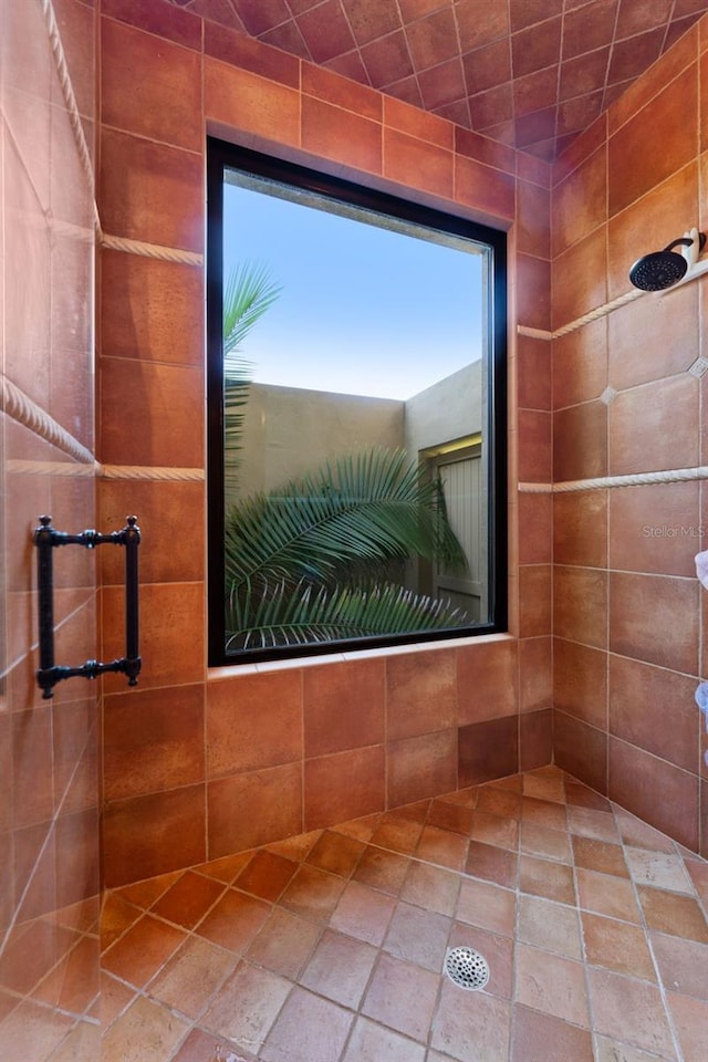 bathroom with tiled shower