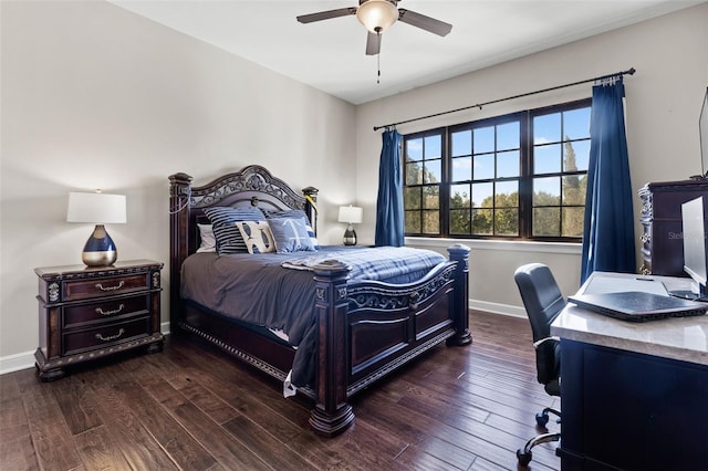 bedroom with dark hardwood / wood-style flooring and ceiling fan