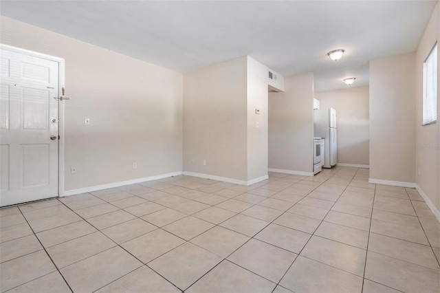 3206 W Azeele St Unit 100, Tampa, FL 33609 - unfurnished room with light tile patterned floors and baseboards