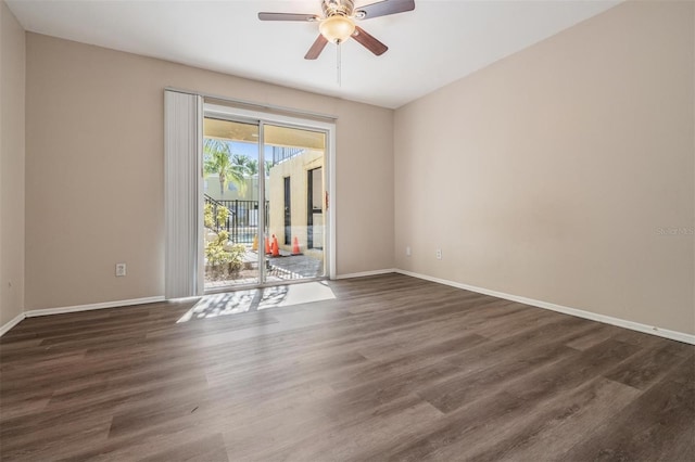 unfurnished room with ceiling fan and dark wood-type flooring