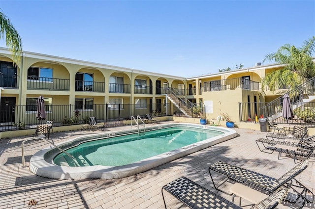 view of swimming pool featuring a patio area