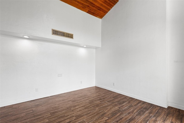 unfurnished room with dark hardwood / wood-style flooring, high vaulted ceiling, and wood ceiling