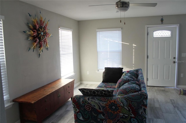 entrance foyer with ceiling fan and light hardwood / wood-style floors