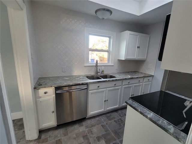 kitchen with range, sink, stainless steel dishwasher, light stone counters, and white cabinetry