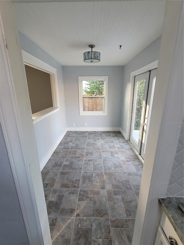 unfurnished dining area featuring a healthy amount of sunlight