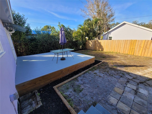 view of yard with a wooden deck