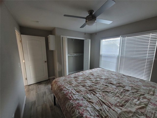 bedroom featuring a closet, hardwood / wood-style flooring, and ceiling fan