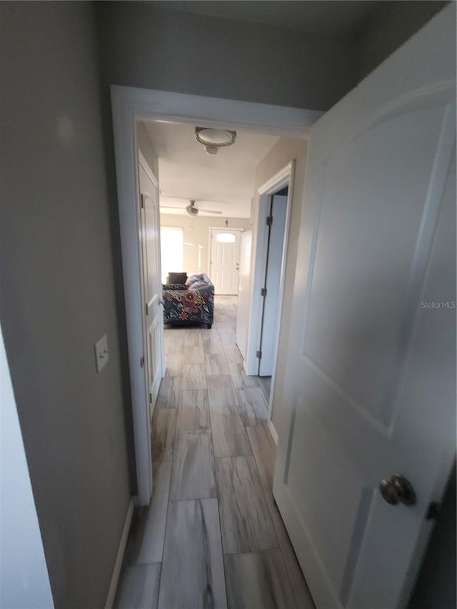 corridor featuring light wood-type flooring