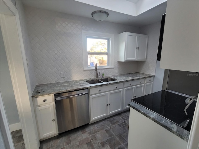 kitchen featuring dishwasher, sink, decorative backsplash, light stone countertops, and white cabinetry