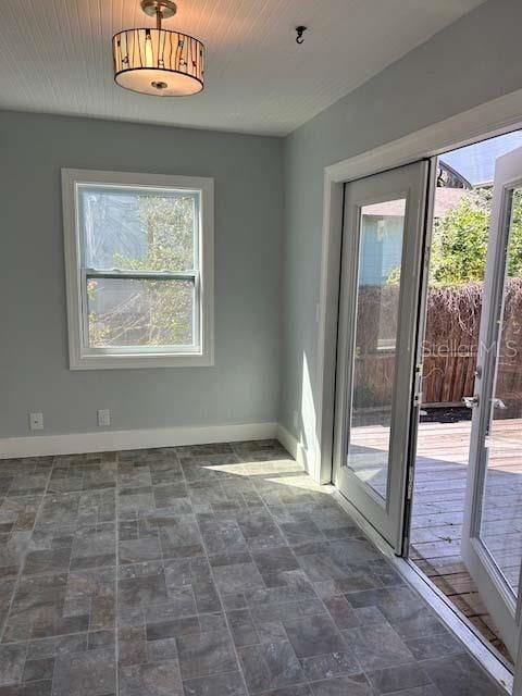 unfurnished dining area with french doors