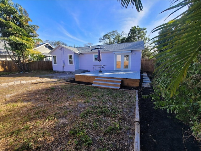 back of house featuring a deck