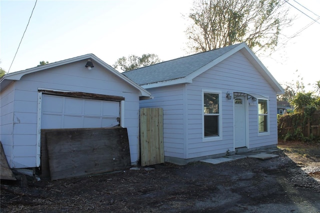 view of front of home featuring an outbuilding and a garage