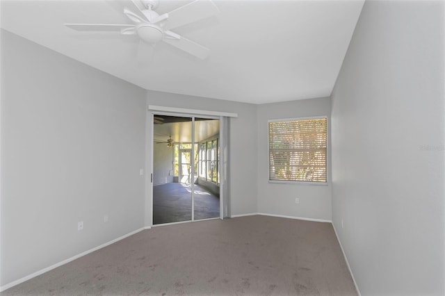 carpeted empty room with ceiling fan