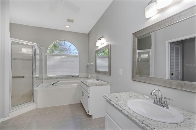 bathroom with tile patterned flooring, vanity, and shower with separate bathtub