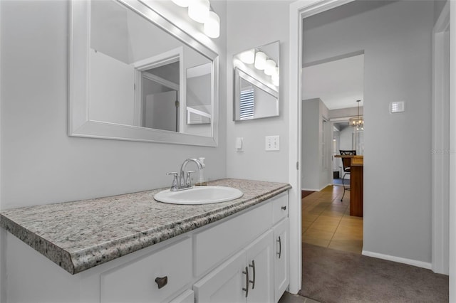 bathroom with tile patterned flooring and vanity