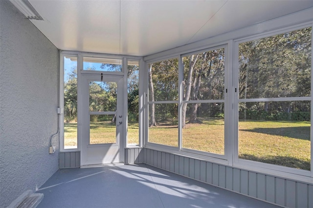 unfurnished sunroom with a wealth of natural light