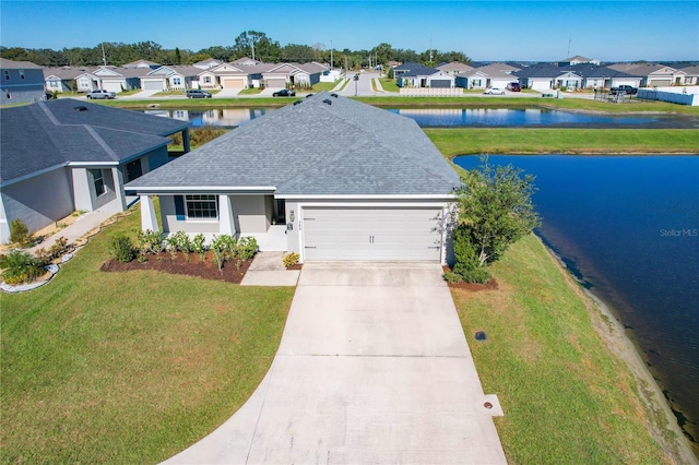 birds eye view of property with a water view