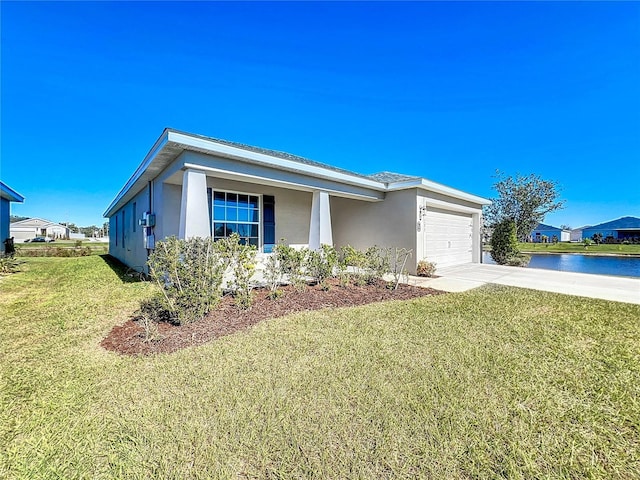 single story home featuring a front yard, a garage, and a water view