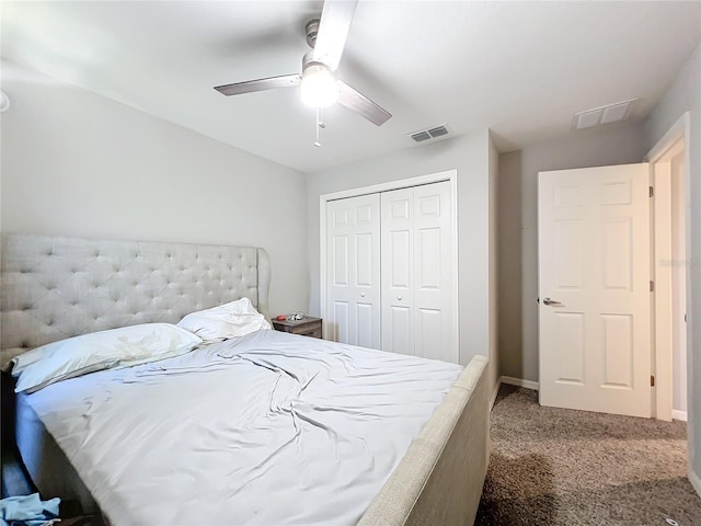 carpeted bedroom featuring ceiling fan and a closet