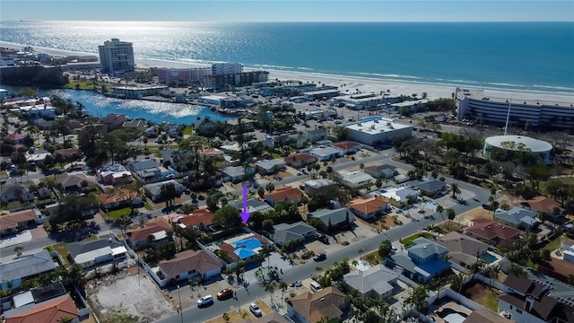 drone / aerial view featuring a view of the beach and a water view