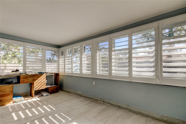 sunroom / solarium featuring plenty of natural light