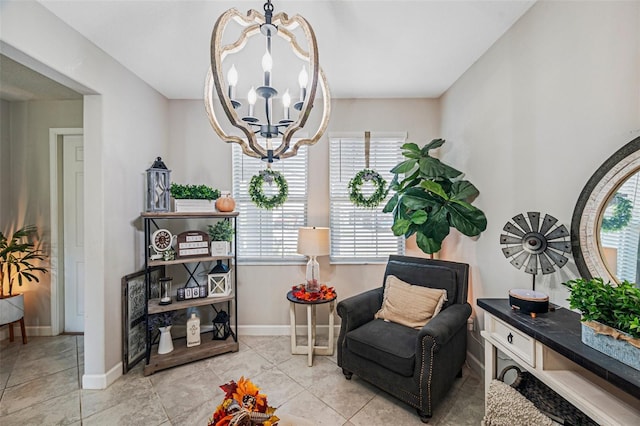 living area with light tile patterned floors and an inviting chandelier