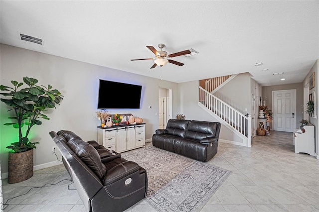 living room featuring ceiling fan and light tile patterned floors