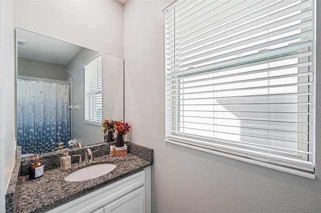 bathroom with vanity and a healthy amount of sunlight