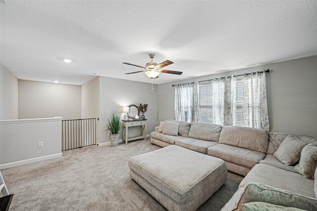 11321 Chilly Water Ct, Riverview, FL 33569 - carpeted living area featuring a ceiling fan, a textured ceiling, and baseboards