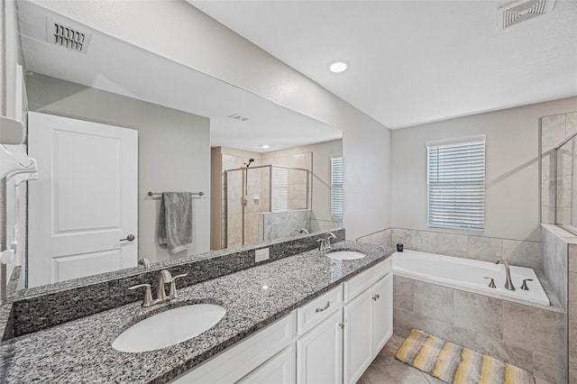 11321 Chilly Water Ct, Riverview, FL 33569 - full bath with a stall shower, a garden tub, double vanity, tile patterned floors, and recessed lighting