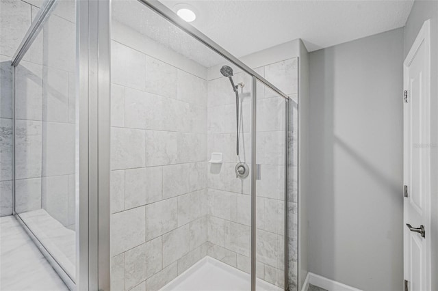 11321 Chilly Water Ct, Riverview, FL 33569 - bathroom featuring a stall shower and baseboards