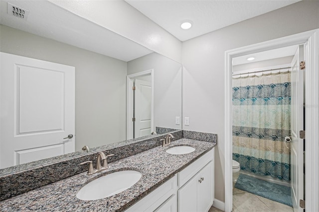 11321 Chilly Water Ct, Riverview, FL 33569 - full bath with toilet, double vanity, and tile patterned floors