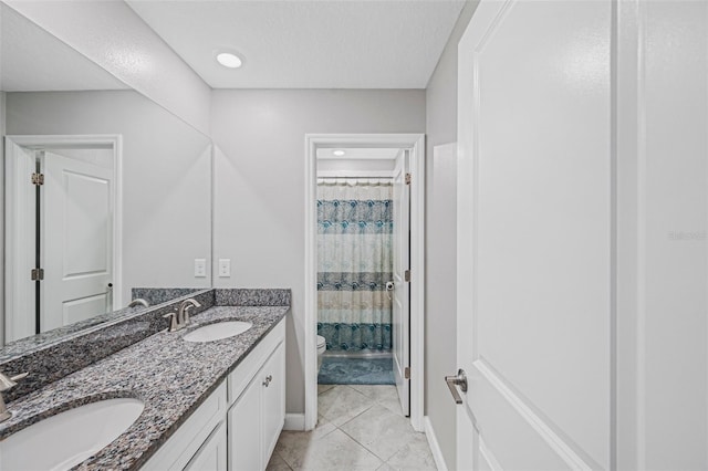 bathroom with tile patterned floors, vanity, toilet, and a shower with shower curtain